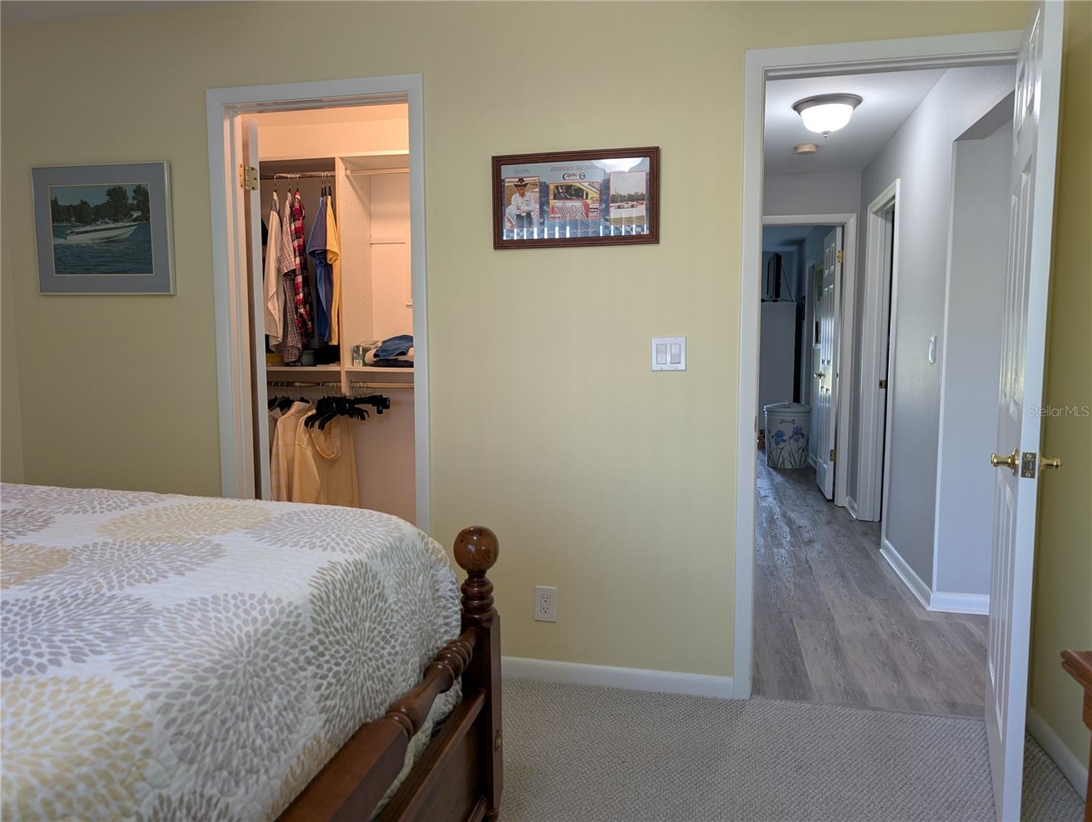 View from guest bedroom down hallway to primary bedroom.