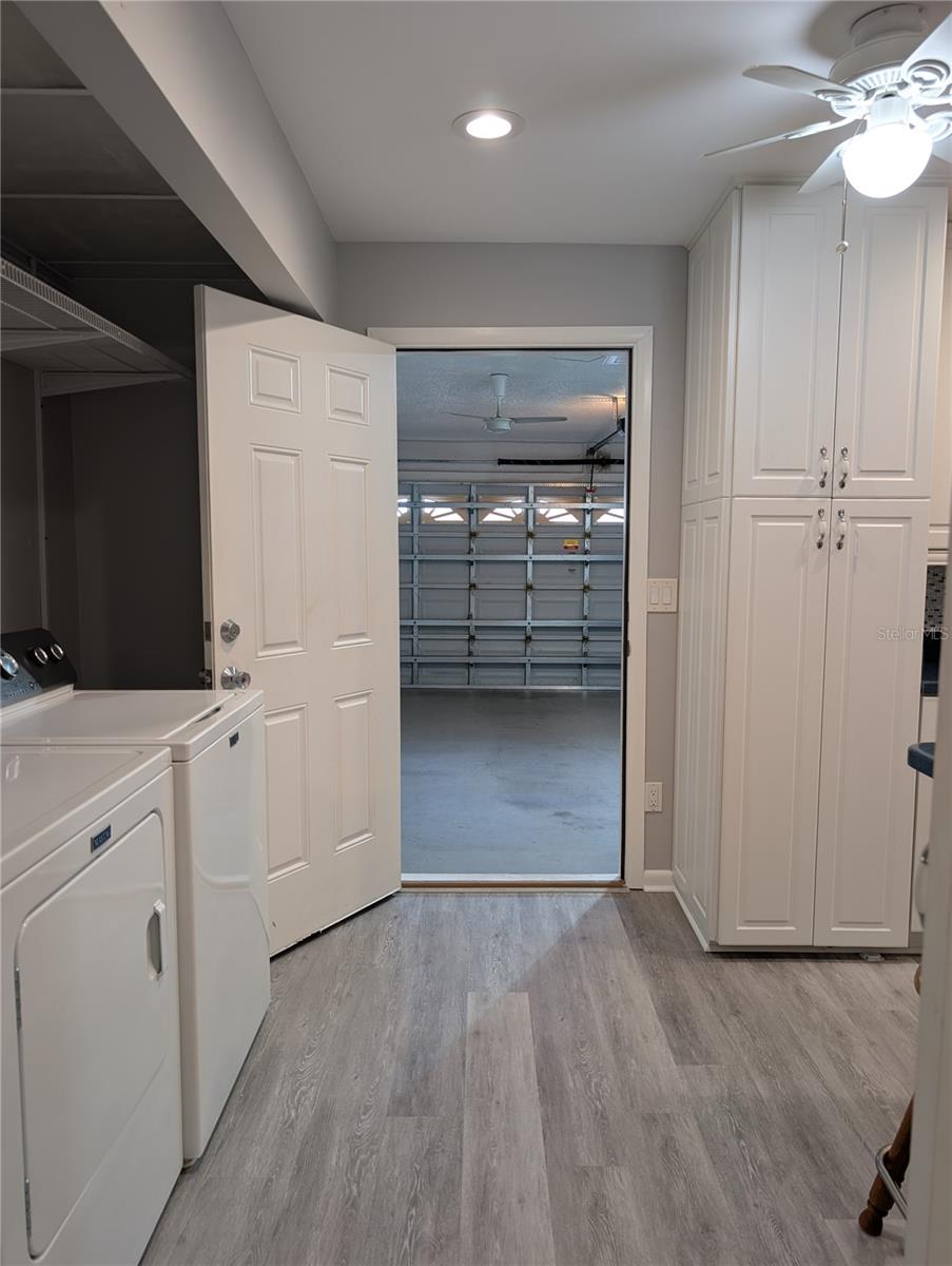 Access to garage was relocated to end of kitchen to make this design possible. A HUGE improvement for the kitchen design.