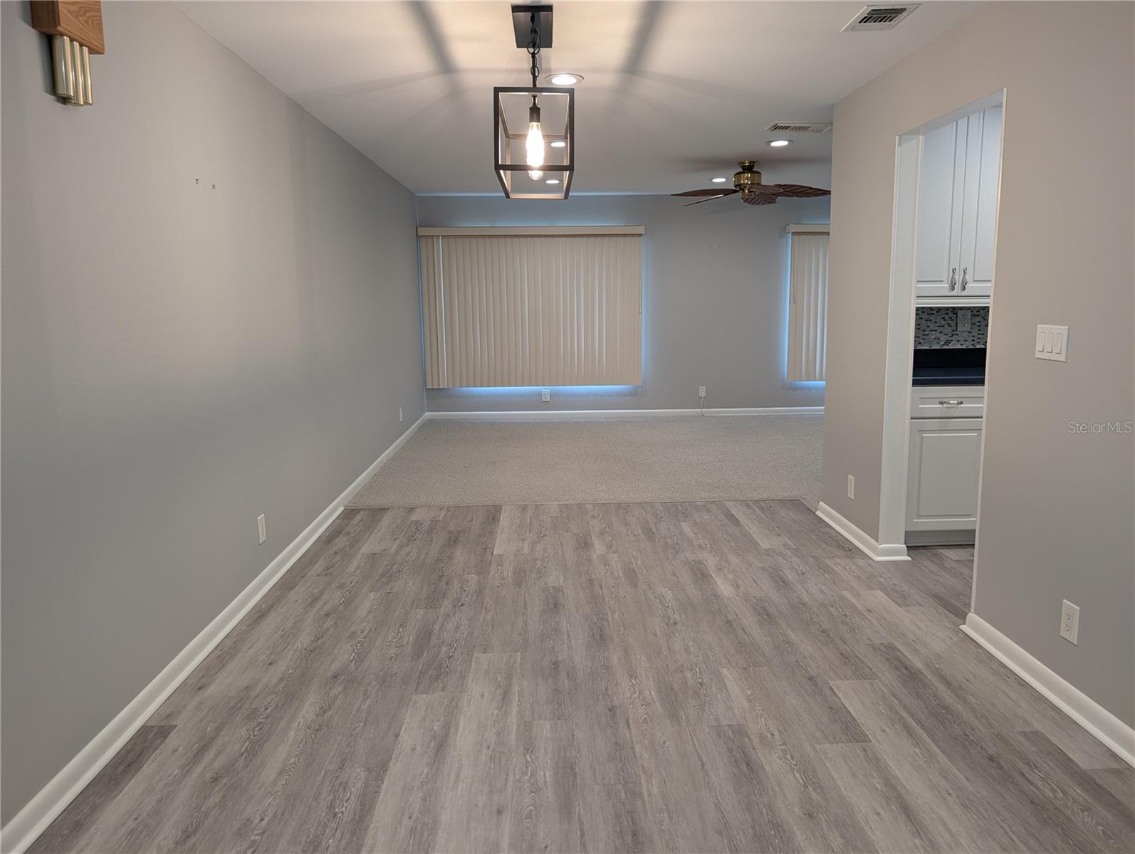 View of open floor plan for dining room, kitchen and Florida room.