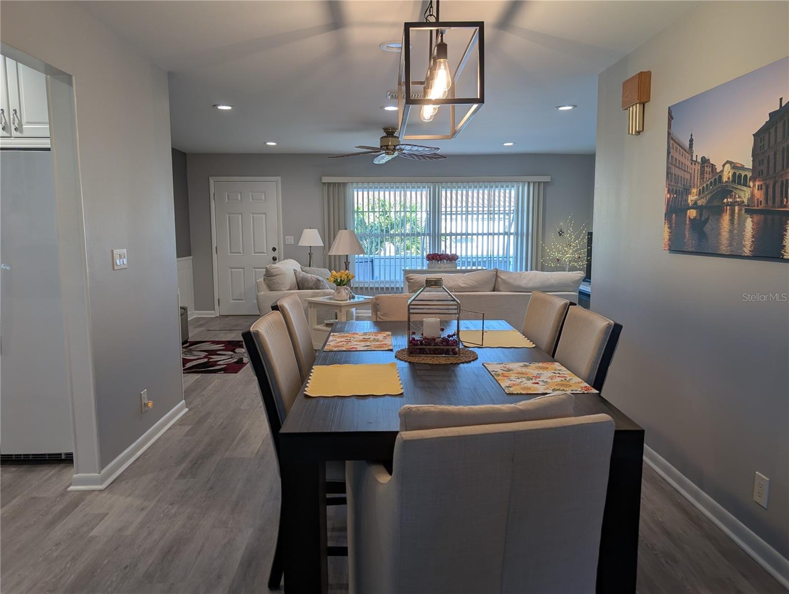 View from dining room thru living room to front entry.