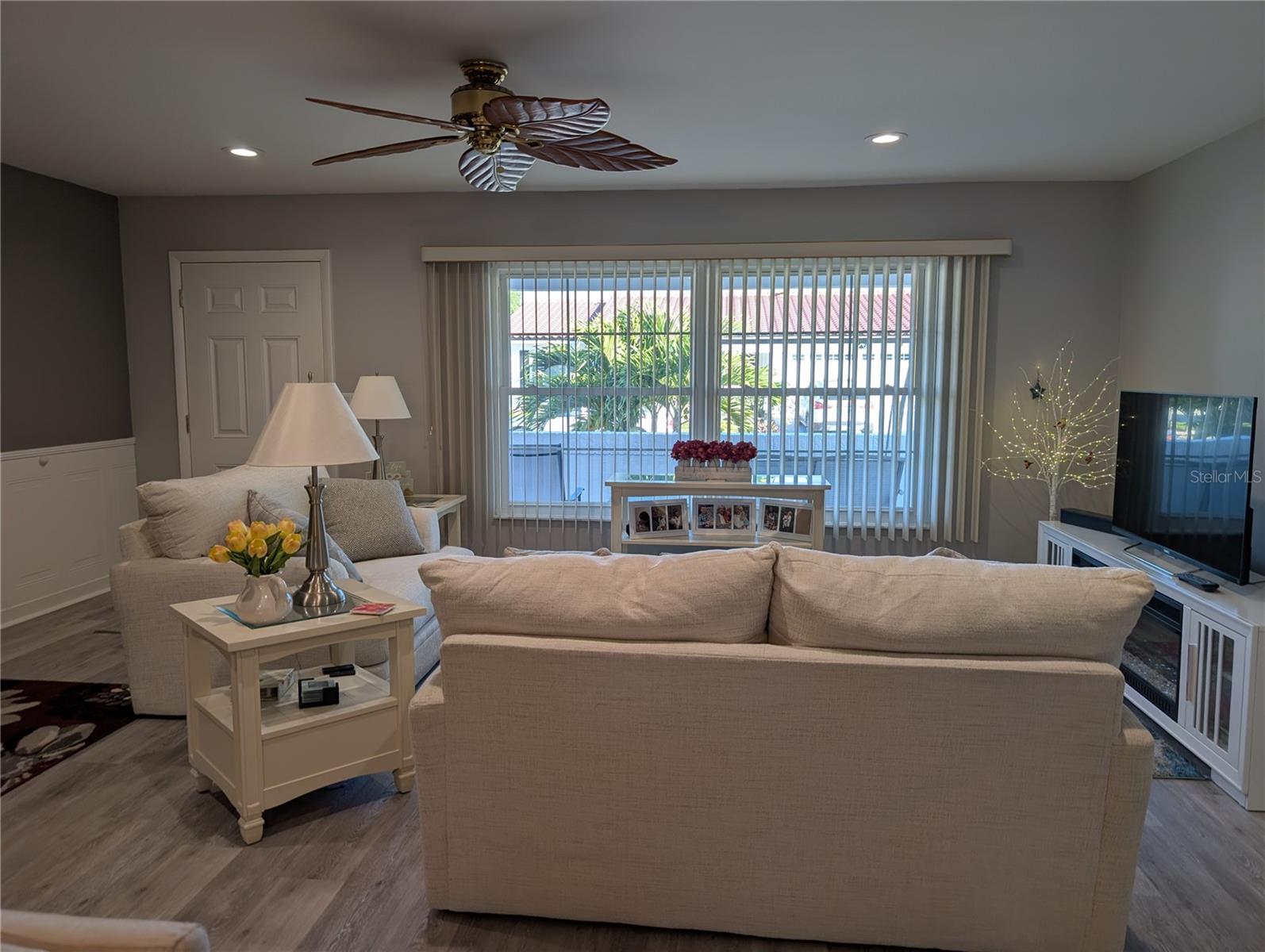 View of living room to front entry.