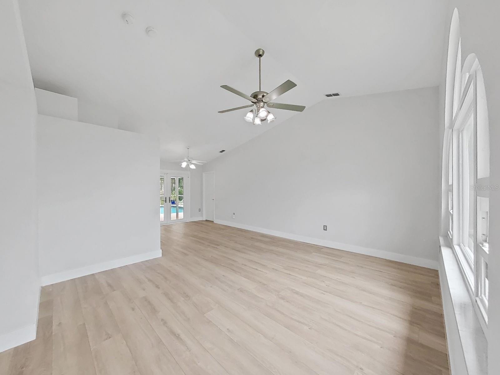 Living room, vaulted ceilings, picture window, but both sides can open for fresh air.