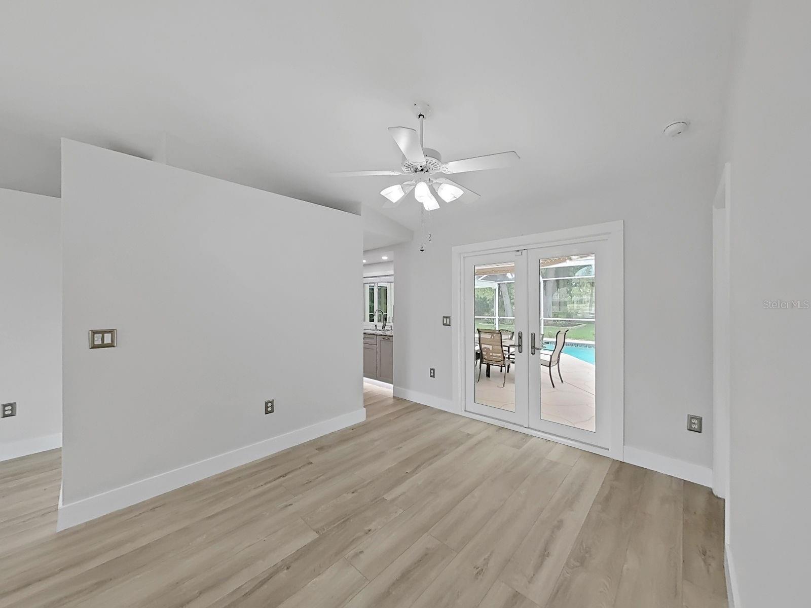 Dining Room with kitchen to  left of the double doors..