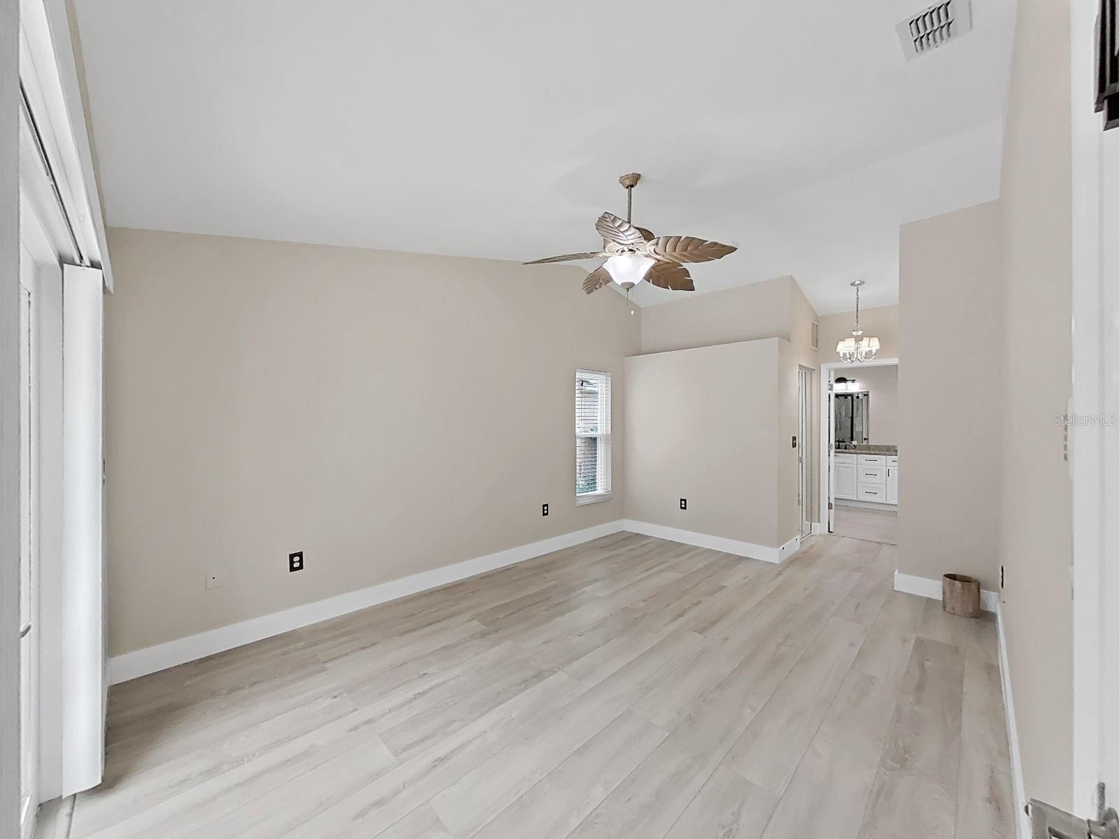 Primary suite with bath area behind the closets.