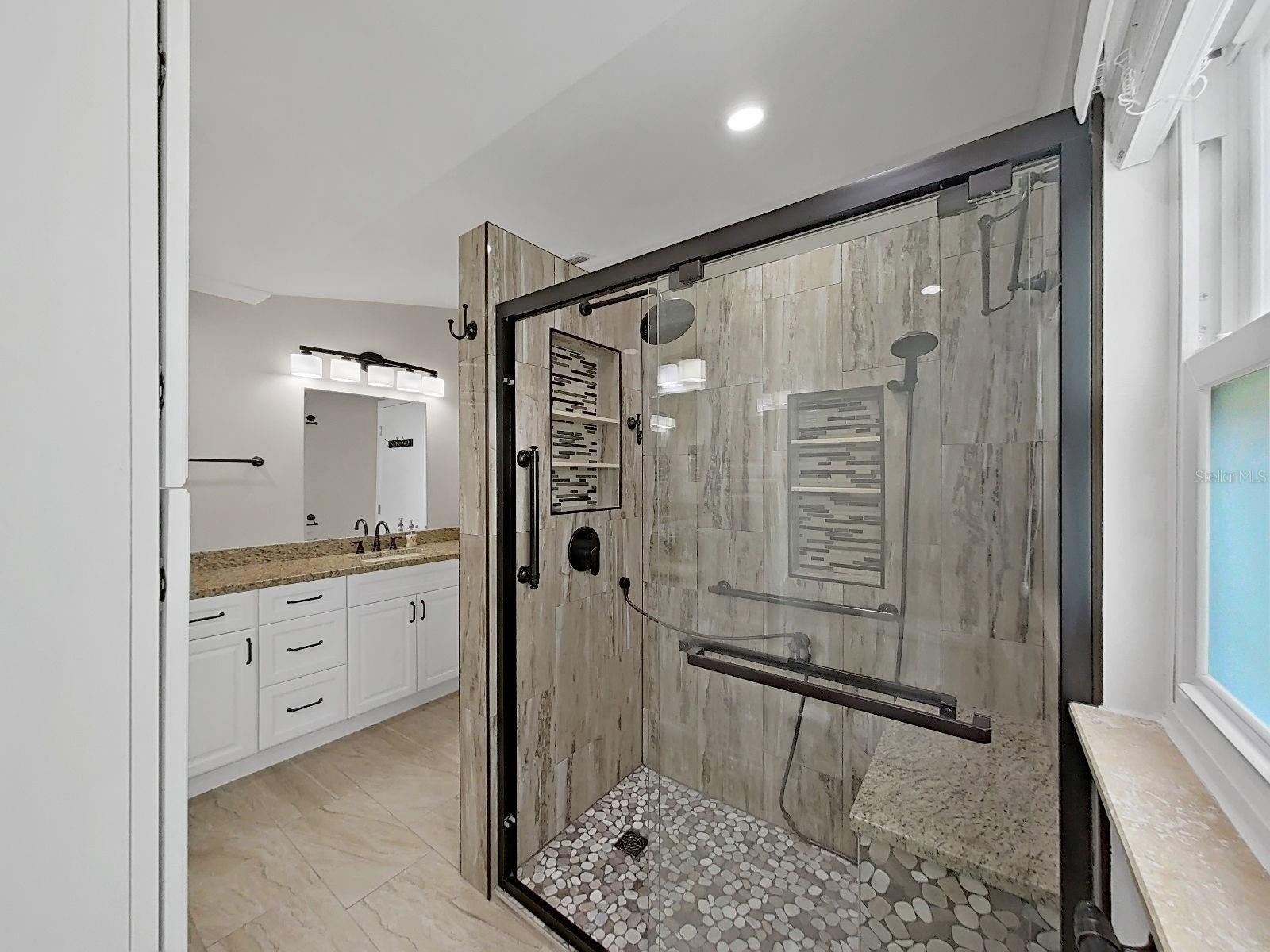 Huge shower, built ins for your shampoo and multiple shower heads.