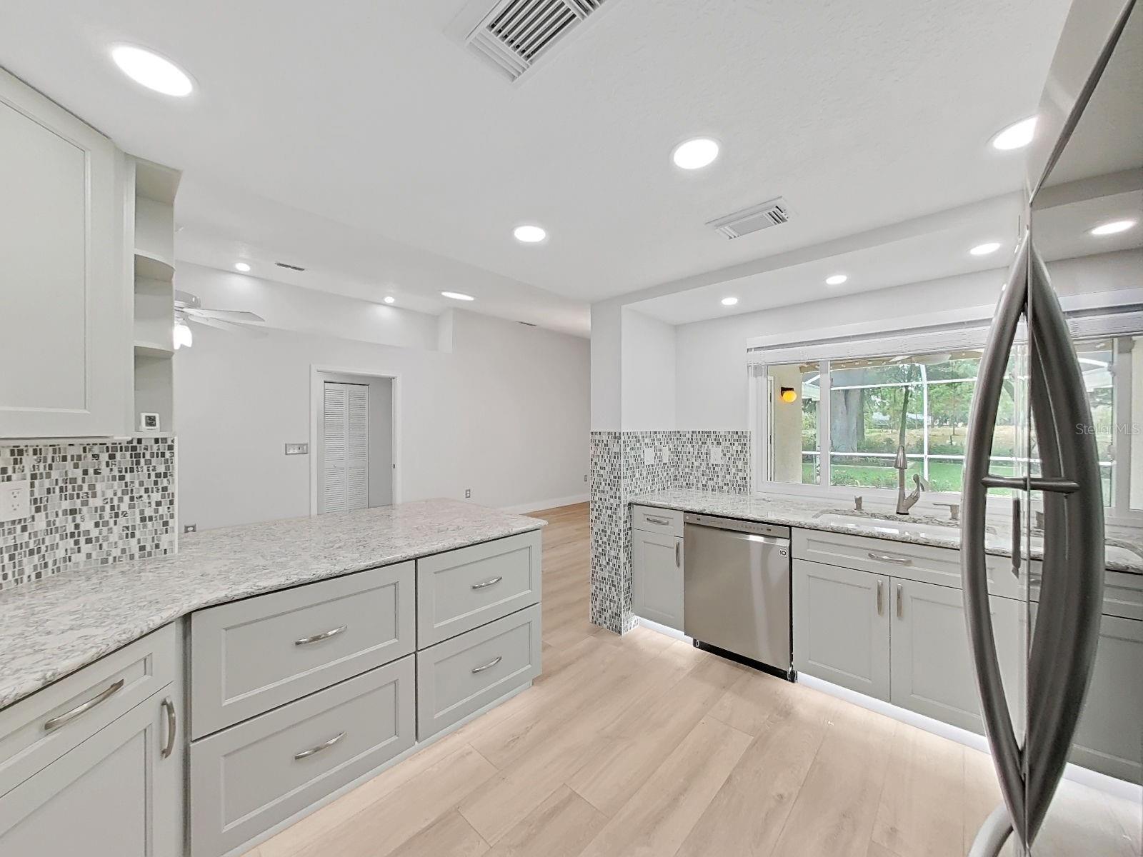 Breakfast Nook to the left of the kitchen. Wash dishes and watch the little ones in the pool, or hurry and join them.