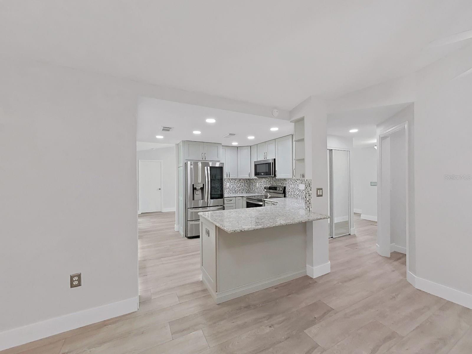 Standing in the breakfast nook, to the very right is entry into laundry room. There's also a foyer closet.