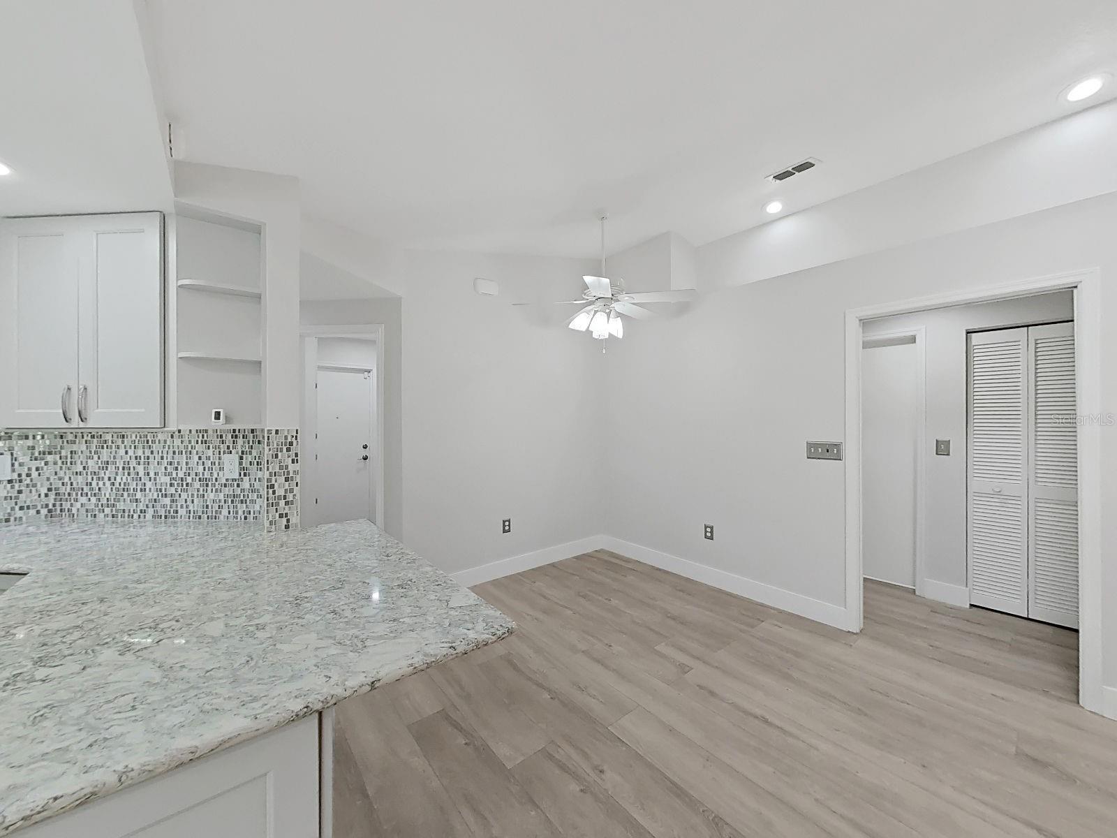 from the breakfast nook  is the hallway to 2 more bedrooms and full bathroom. Linen closet in-between.