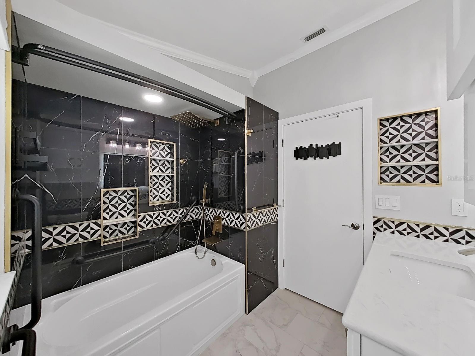 Guest bathroom with full tub.