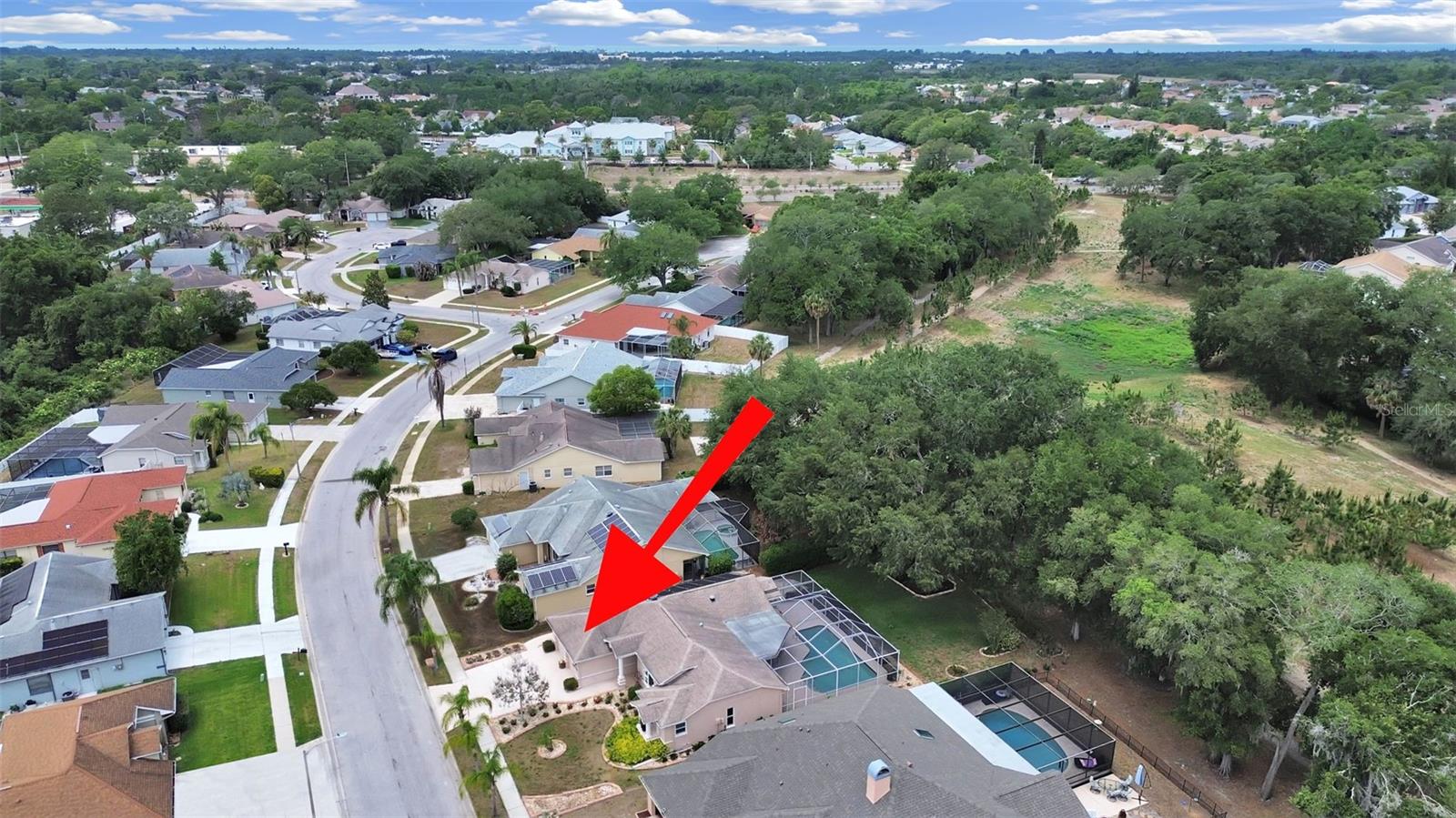 Lush landscaping, magnificent tree canopy and the HOA owns the land that is now a walking trail.