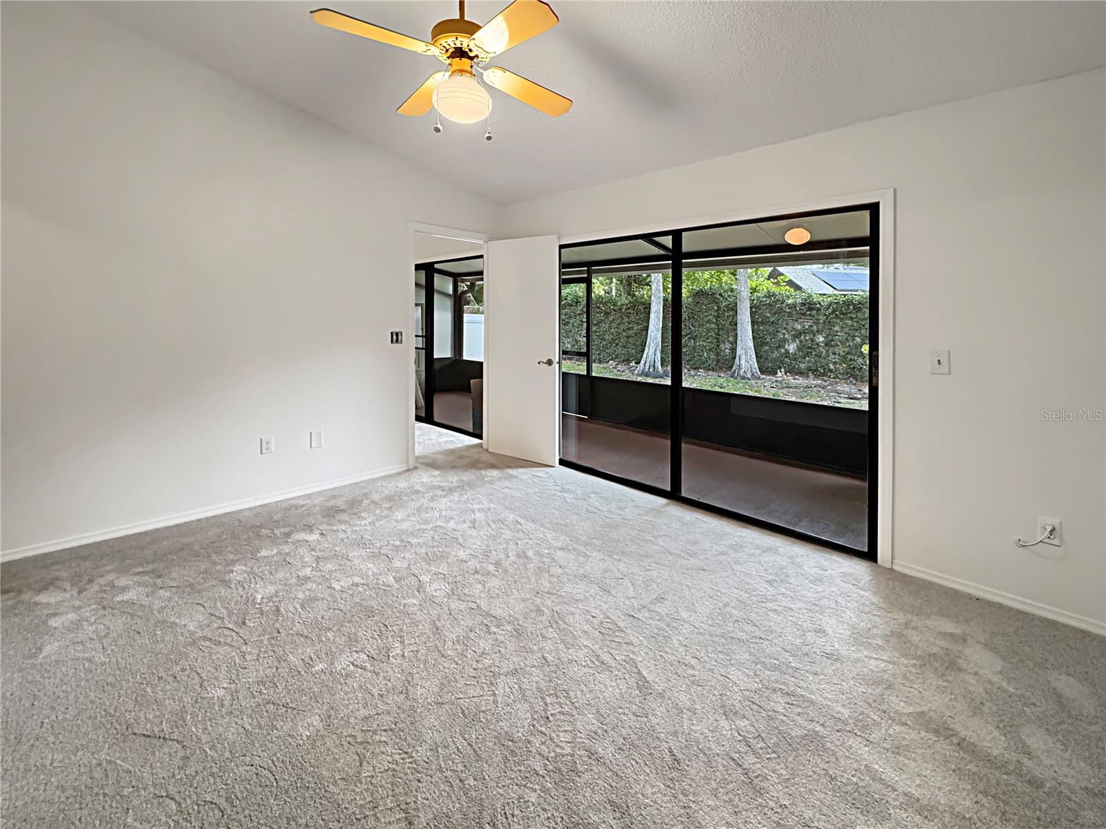 Primary bedroom with direct access to patio