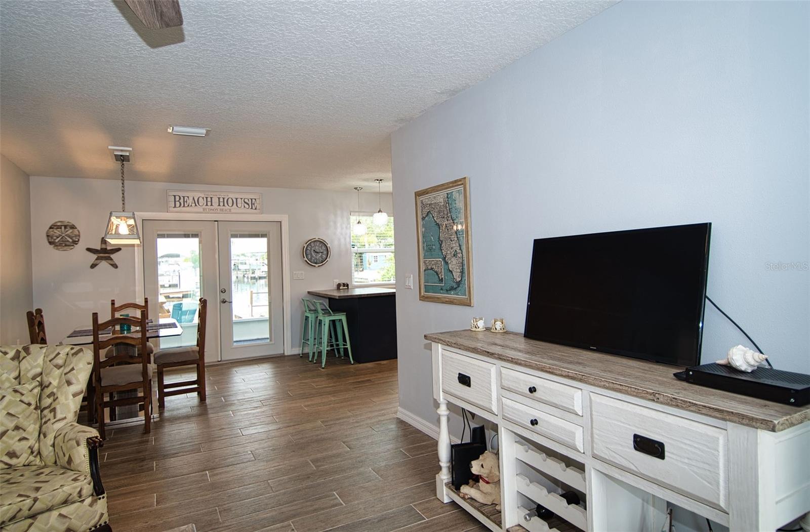 Open floor plan takes you from Living Room to Dining Room and striking kitchen.  Beautiful glass French Doors.  and