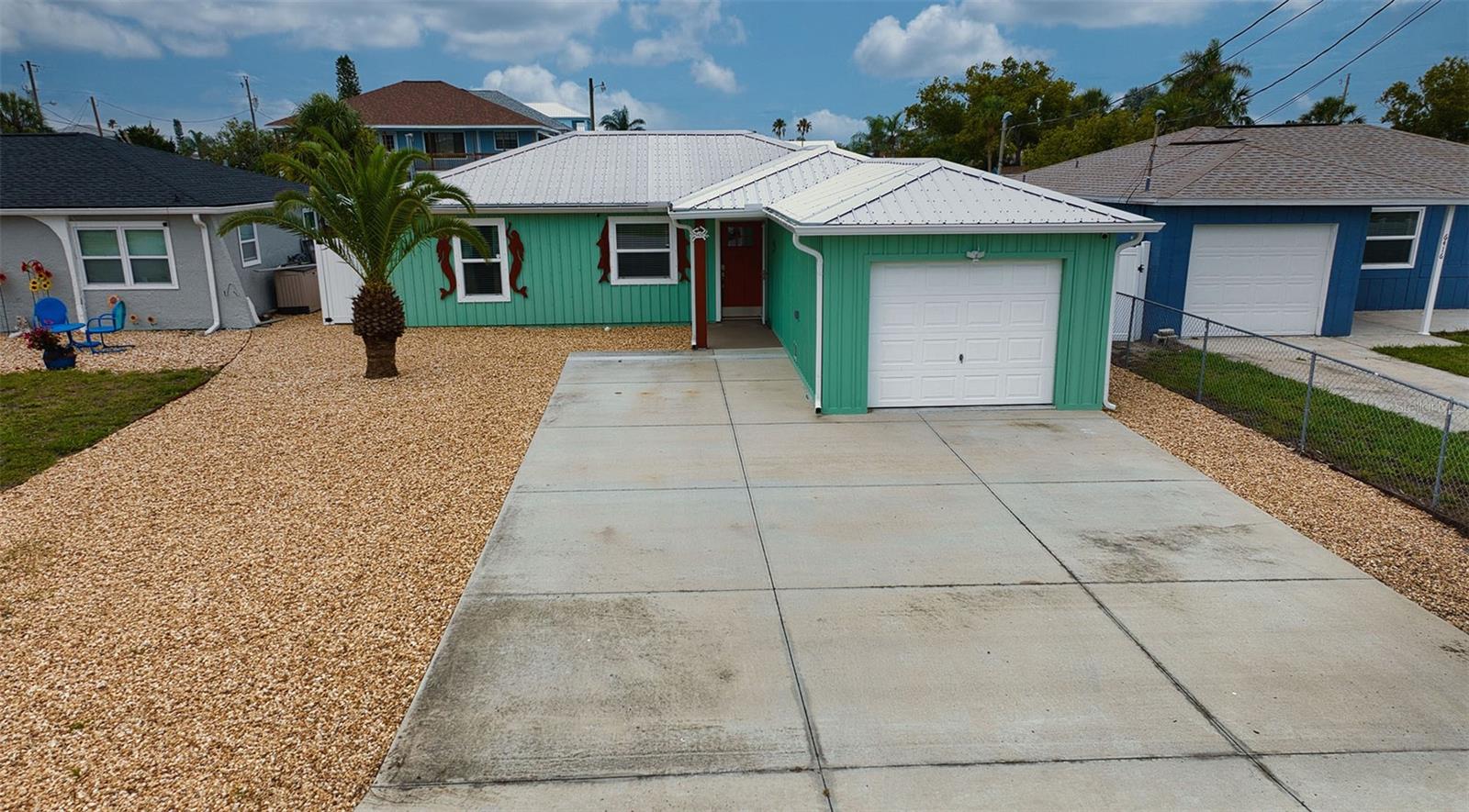 Easy care grounds front and back in addition to oversize parking pad.
