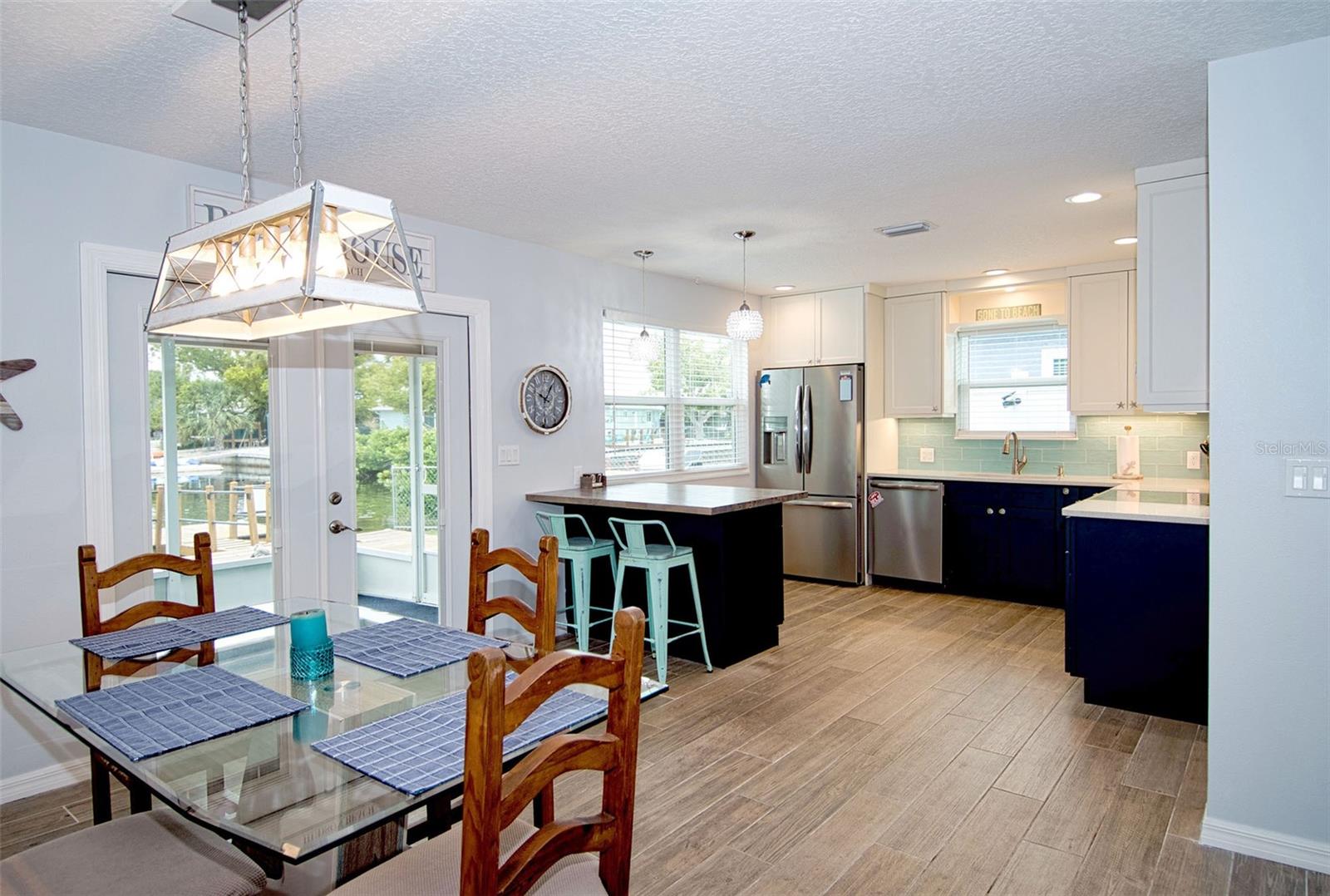 Light and bright with windows and French doors that usher in natural light as well as that coveted water view.