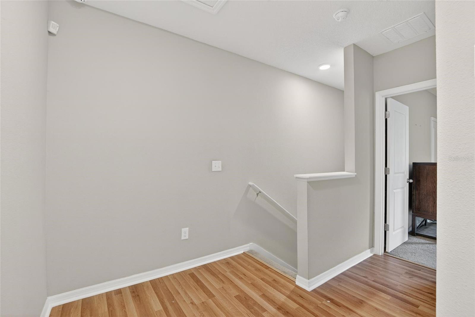 WOOD FLOORS IN HALLWAY