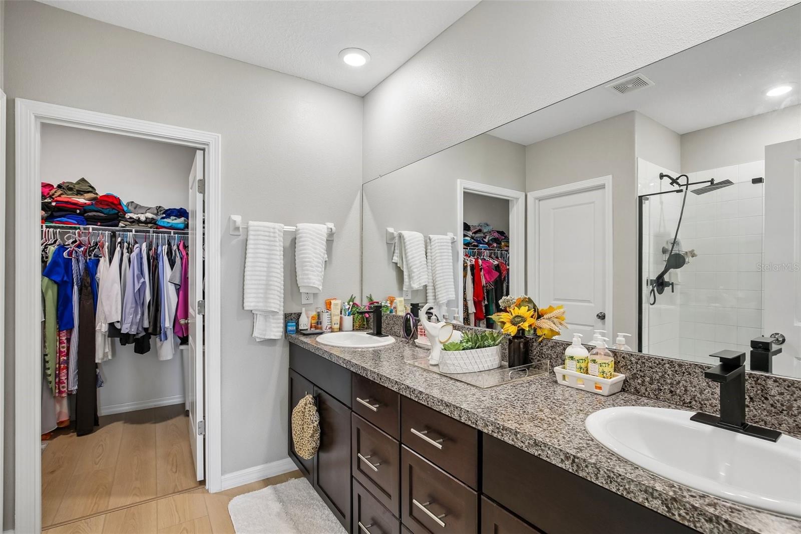 PRIMARY BATH HAS WALK INT SHOWER AND DOUBLE SINK VANITY