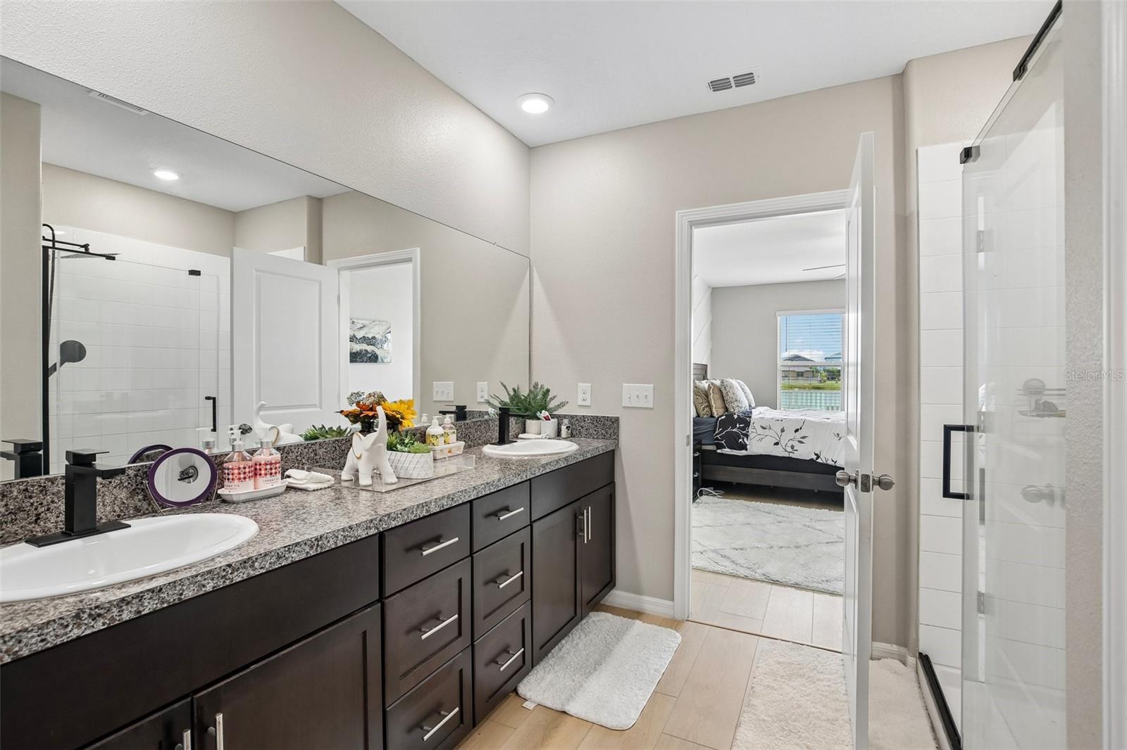 PRIMARY BATH HAS WALK INT SHOWER AND DOUBLE SINK VANITY