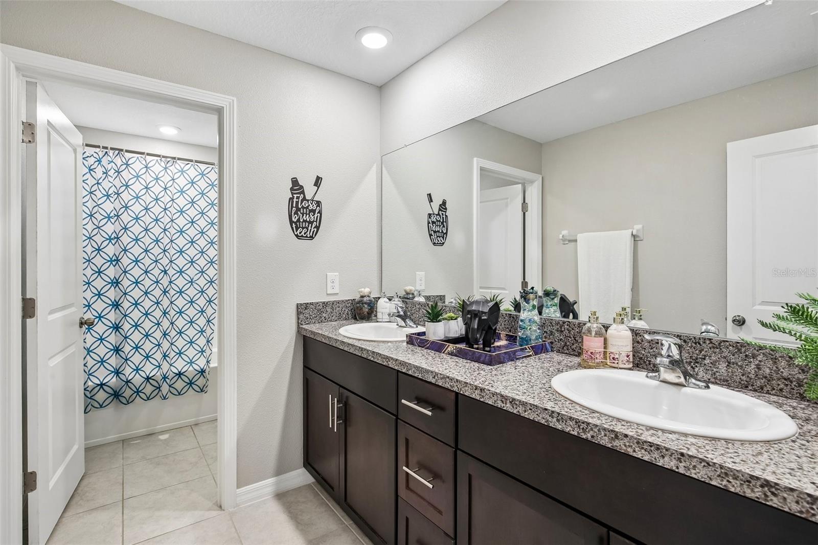 FULL BATH UPSTAIRS HAS DOUBLE SINK VANITY