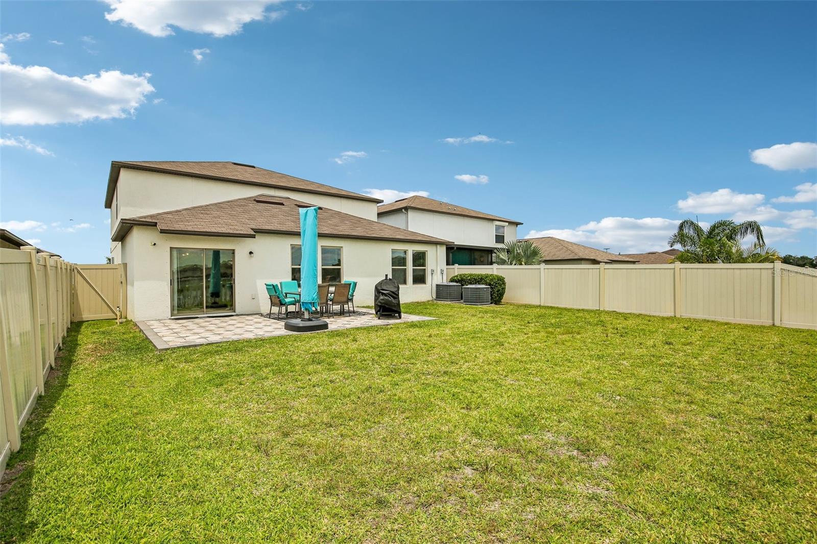 LARGE BACK YARD OVER LOOKING POND HAS PLENTY OF ROOM TO ADD A PRIVATE POOL