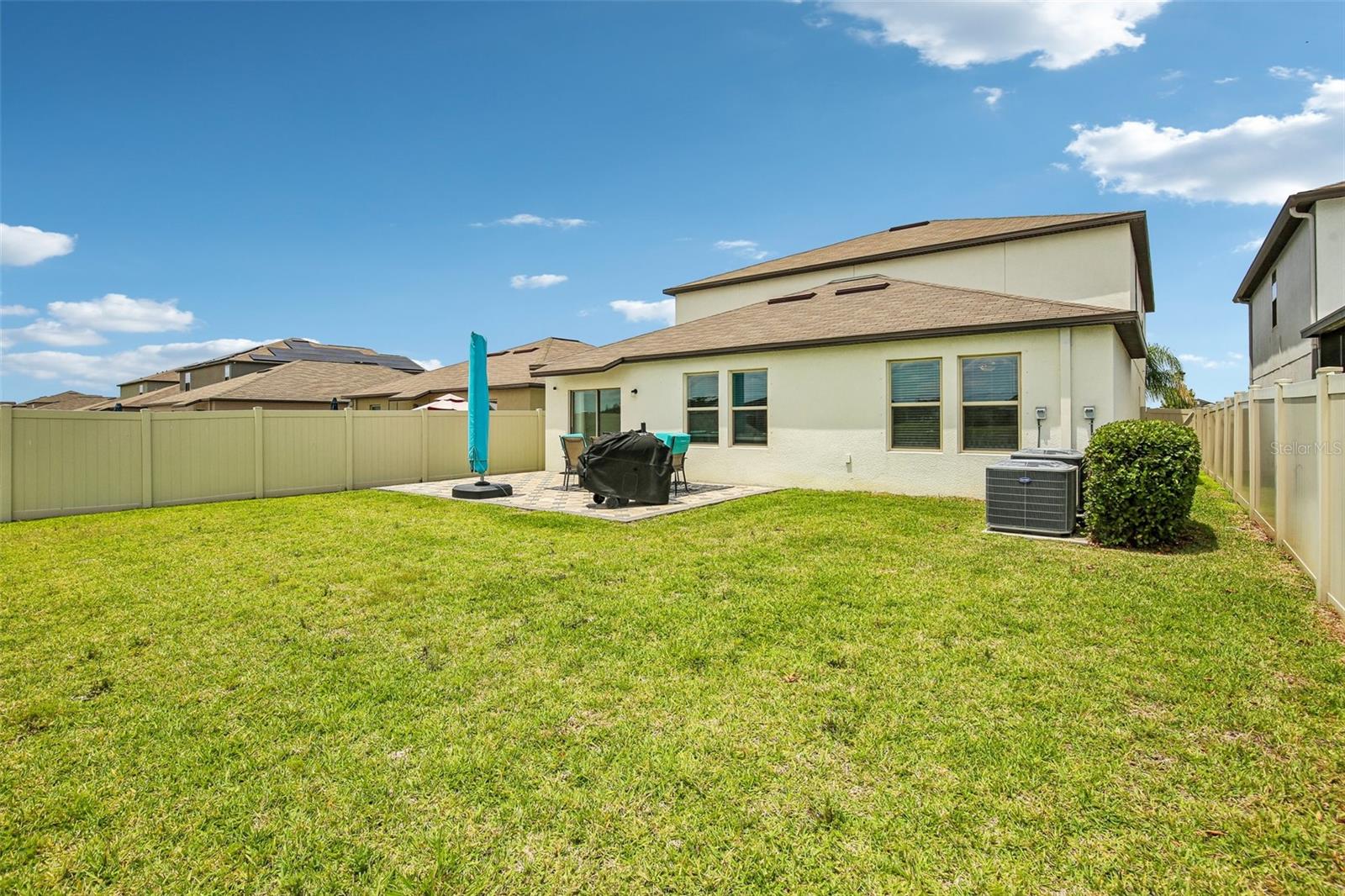 LARGE BACK YARD OVER LOOKING POND HAS PLENTY OF ROOM TO ADD A PRIVATE POOL