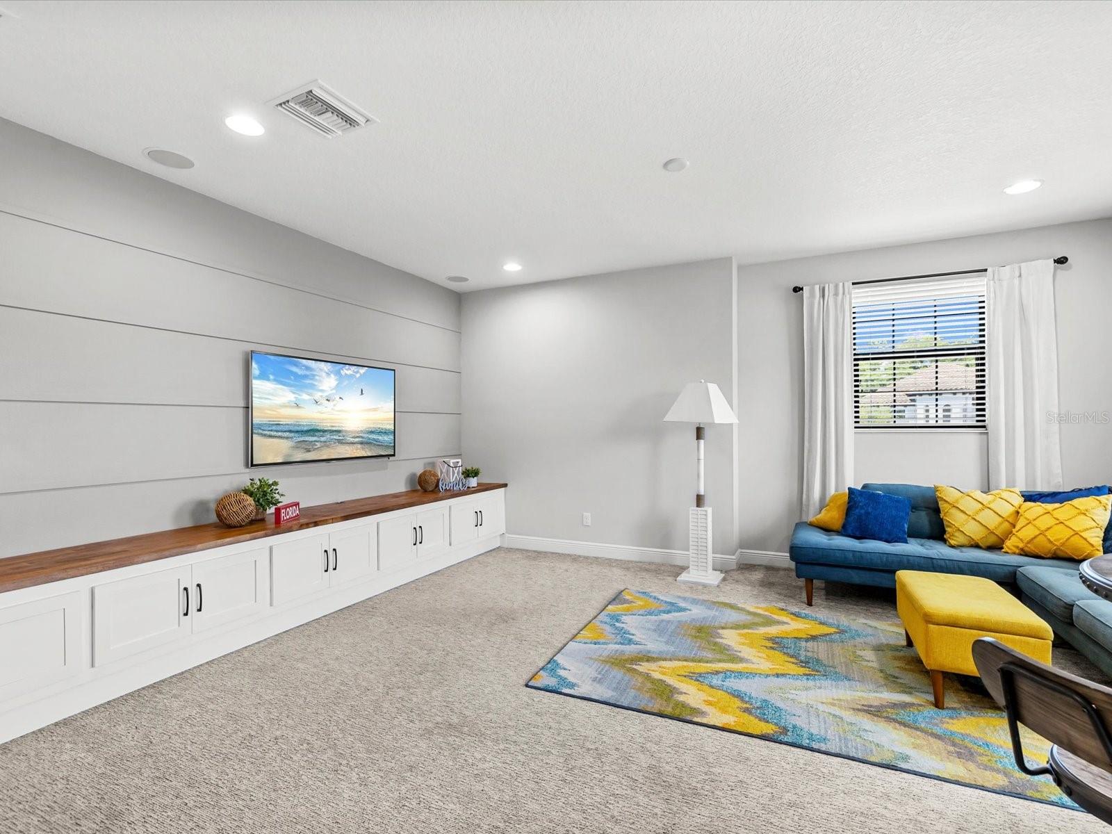 Bonus room with built in wood cabinets
