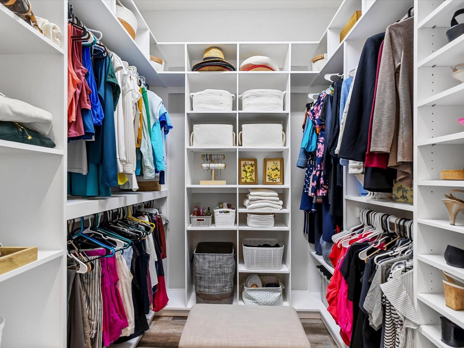 Walk-in closet with custom wood built system