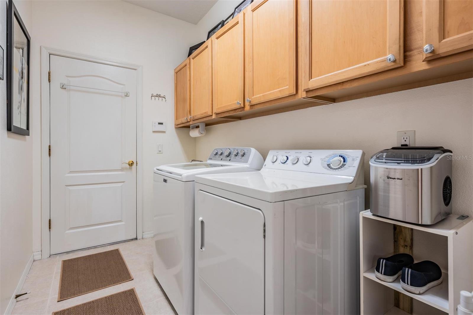 Walk in laundry room with additional storage options