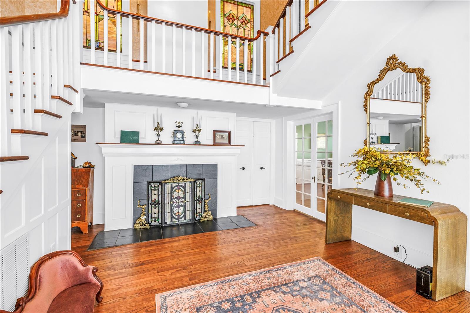 Original stained glass, wood burning fireplace and historical touches