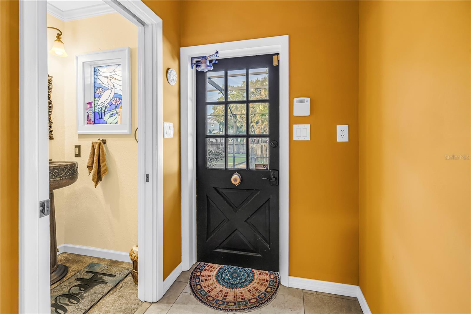 Historical door bell in hallway for pool half bath and laundry room