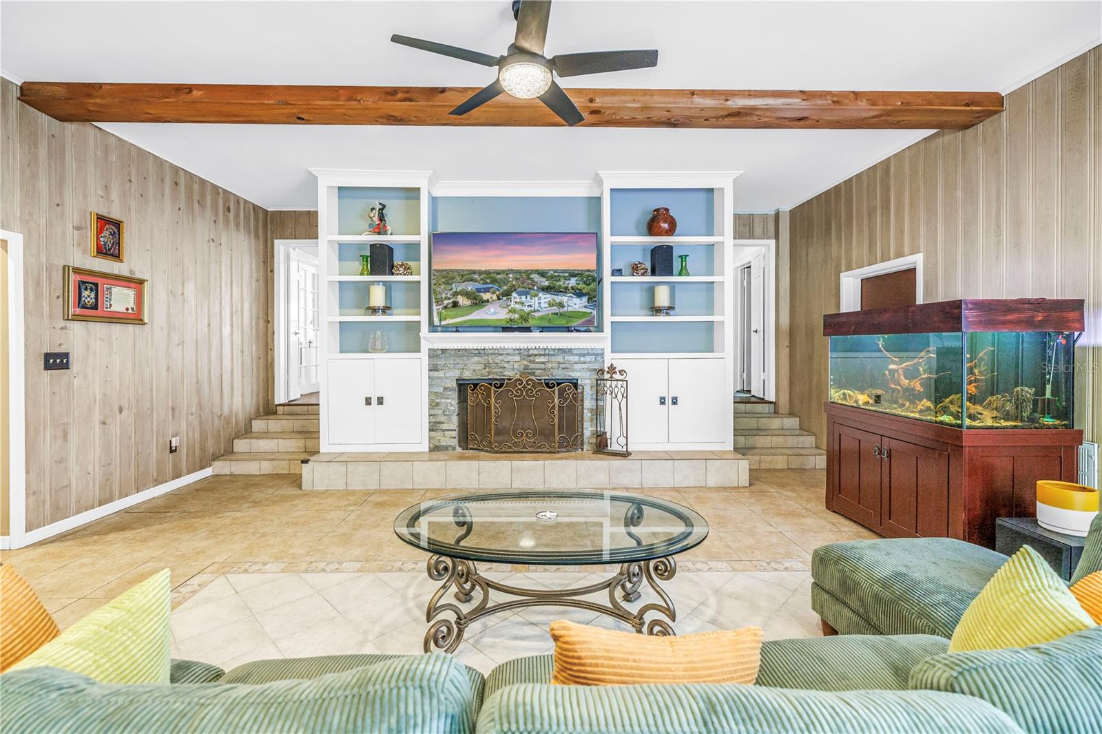 Huge family room with wood burning fireplace (with gas hook up) and storage closets on both sides.