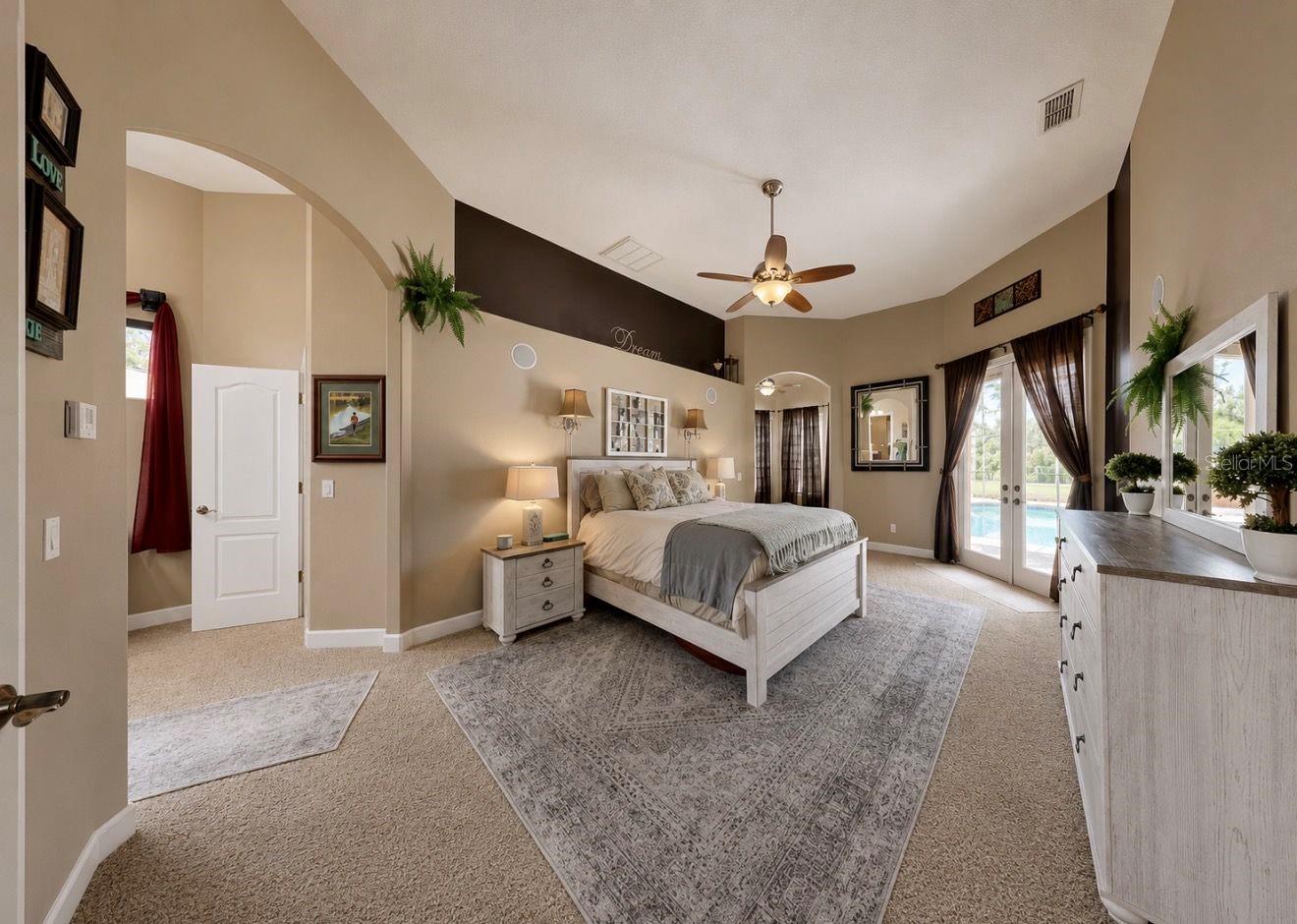 Primary suite with French doors to pool