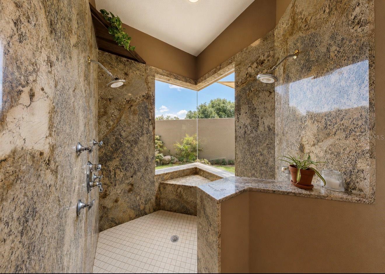 Primary shower overlooking garden and pond