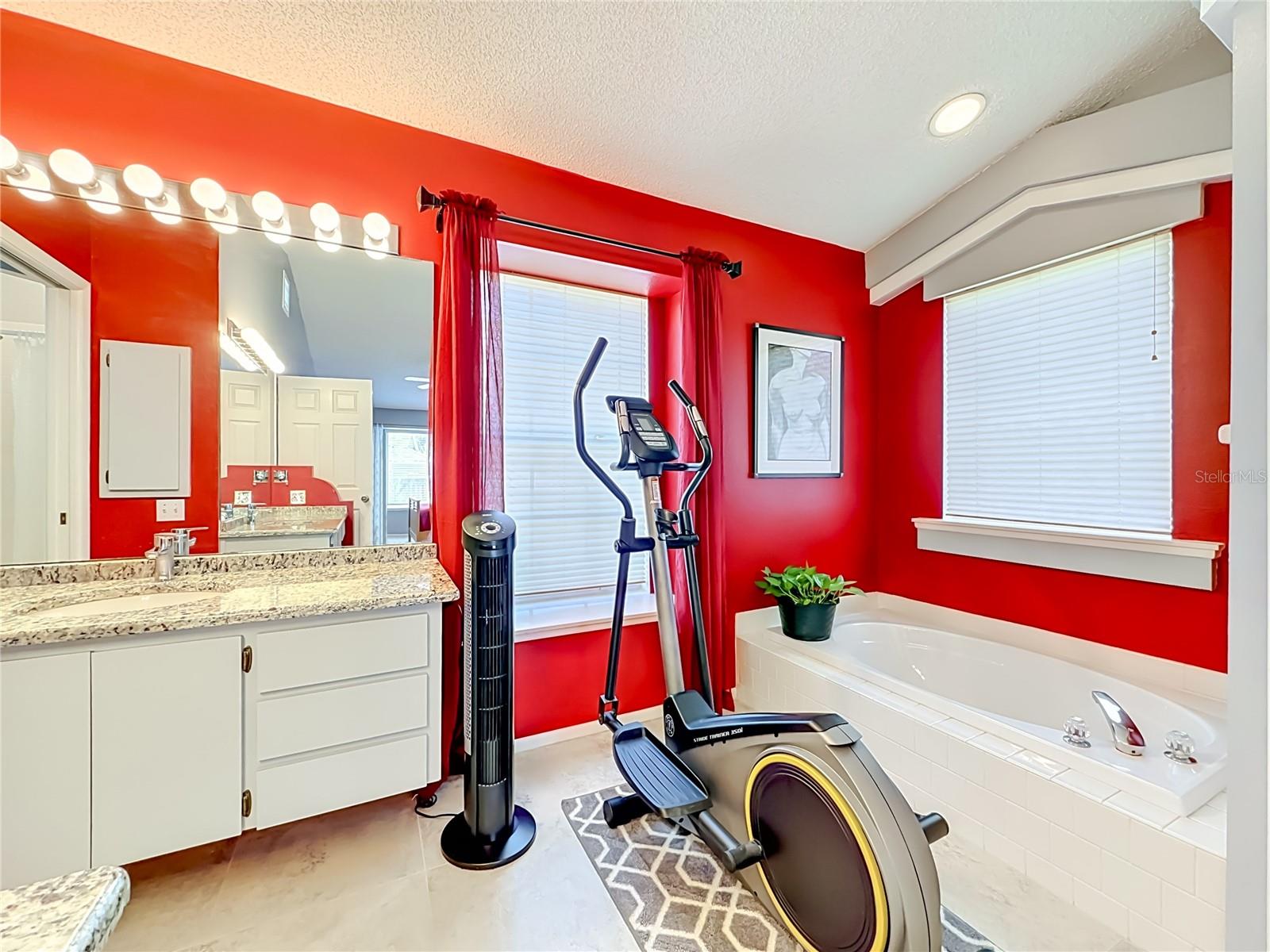 Garden tub, recessed lighting and tile floors in primary bathroom!