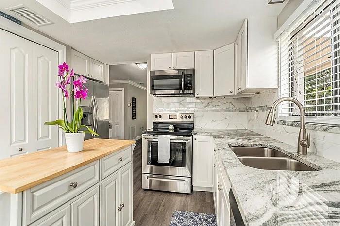 Pictures staged from previous rental. Current tenants in process of moving out.