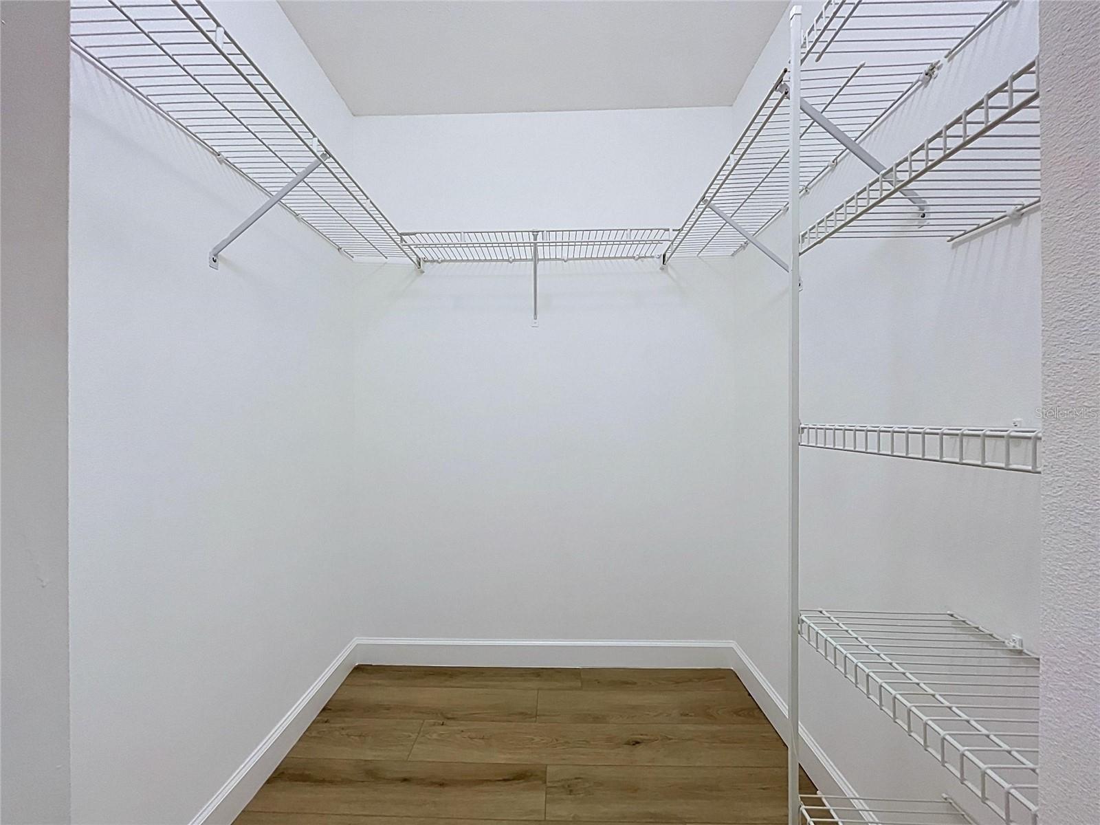 Walk-In Closet in Primary Bedroom Suite