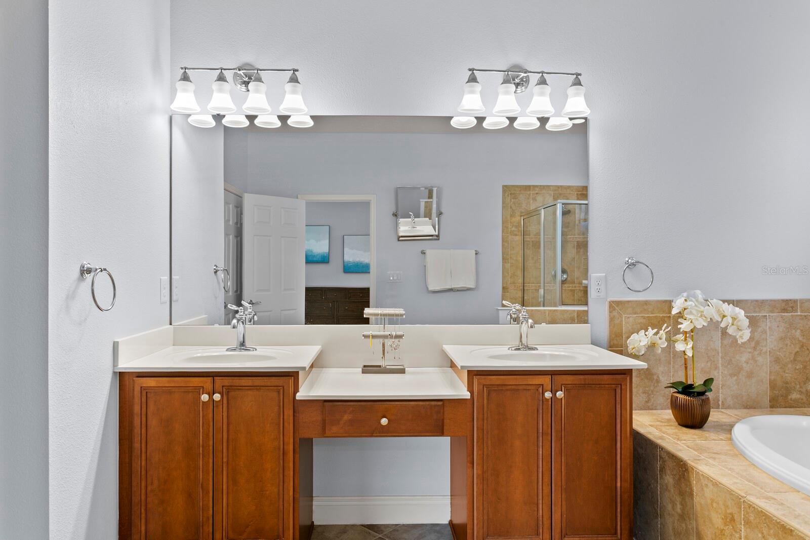Dual vanities and make-up station in primary bath