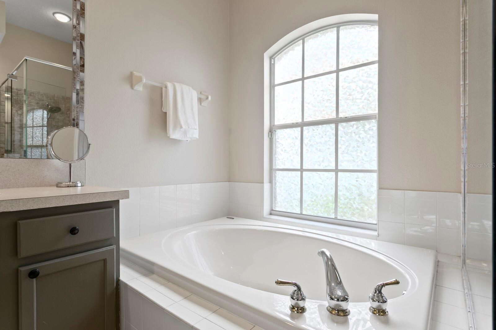 Large soaking tub in primary bath