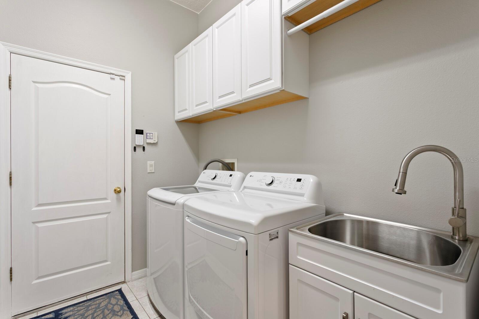 Inside utility room leads out to large 3-car garage