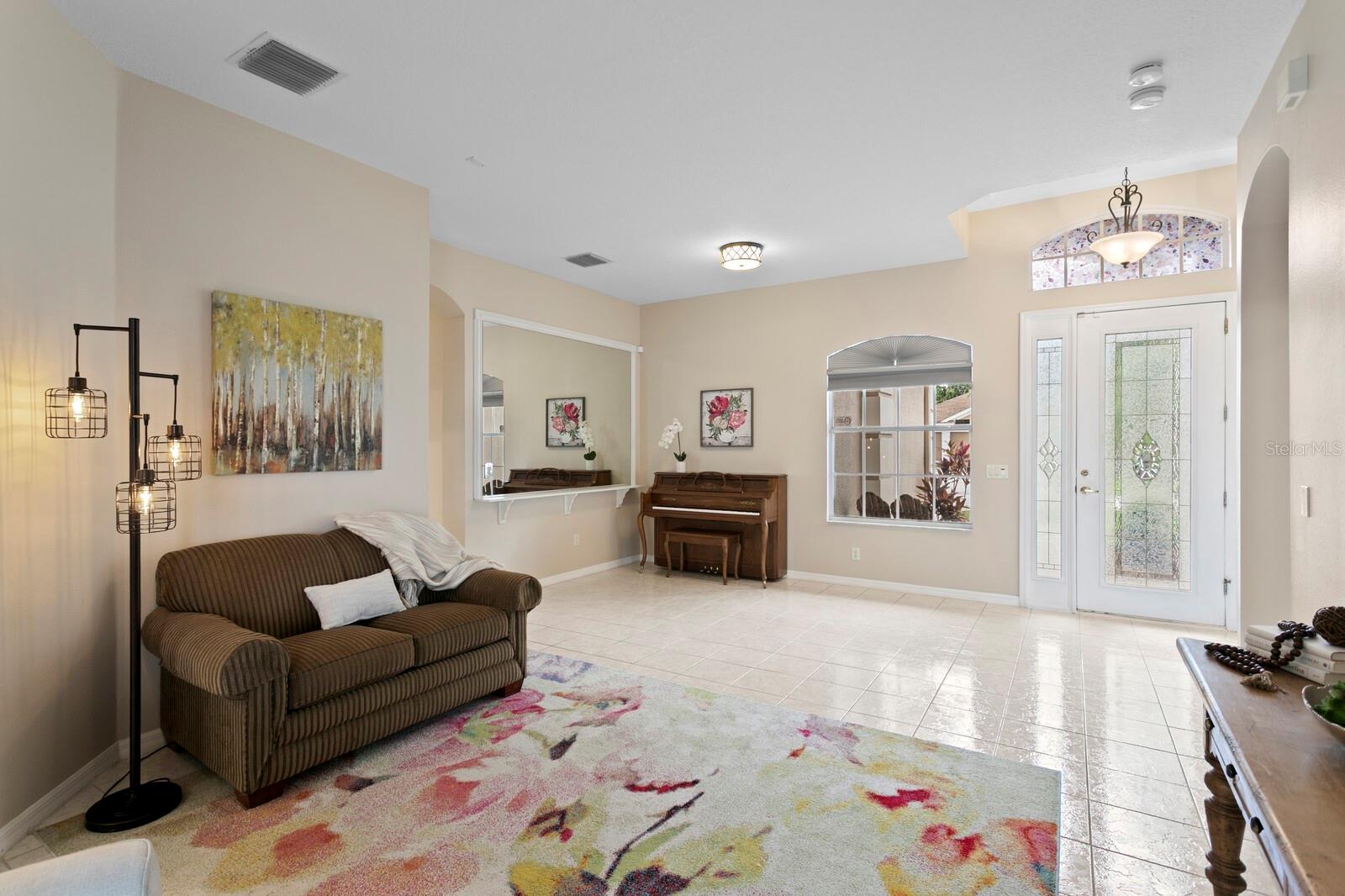Foyer opens to combined living and dining room