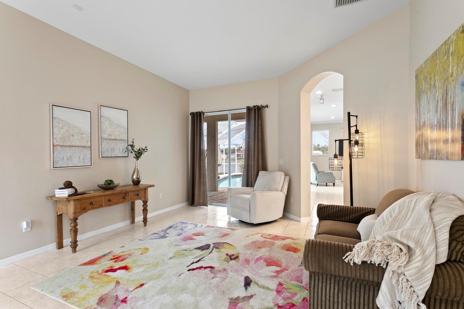 Formal living room with access to the kitchen and lanai