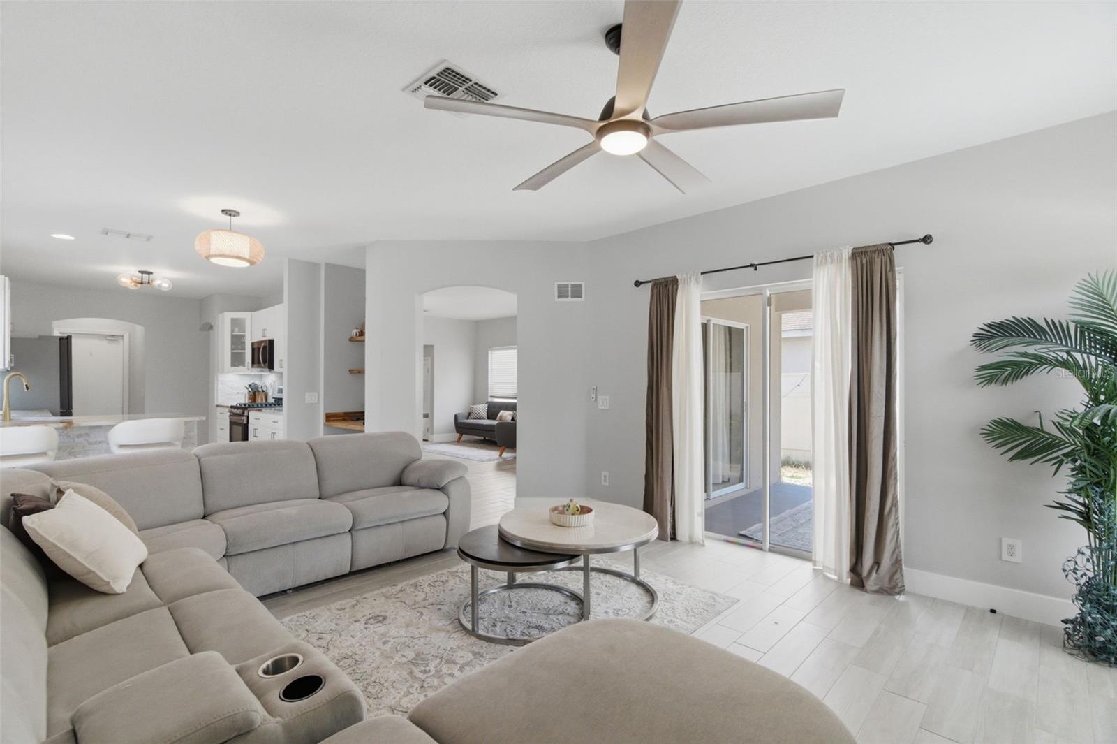 Family Living room with pool access through sliding doors
