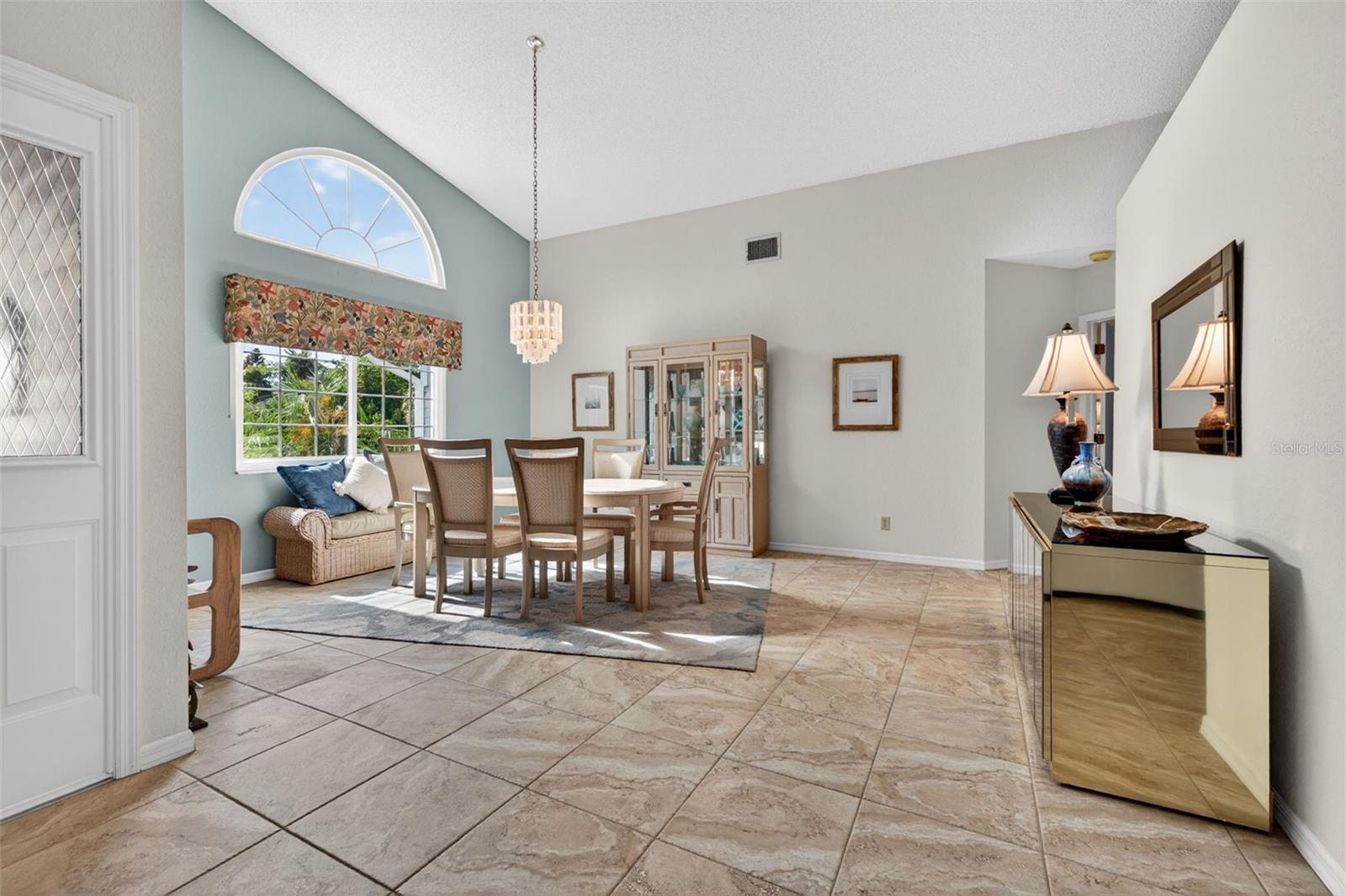 Exceptionally large dining room can accommodate the grandest of gatherings; vaulted ceilings add to the spaciousness