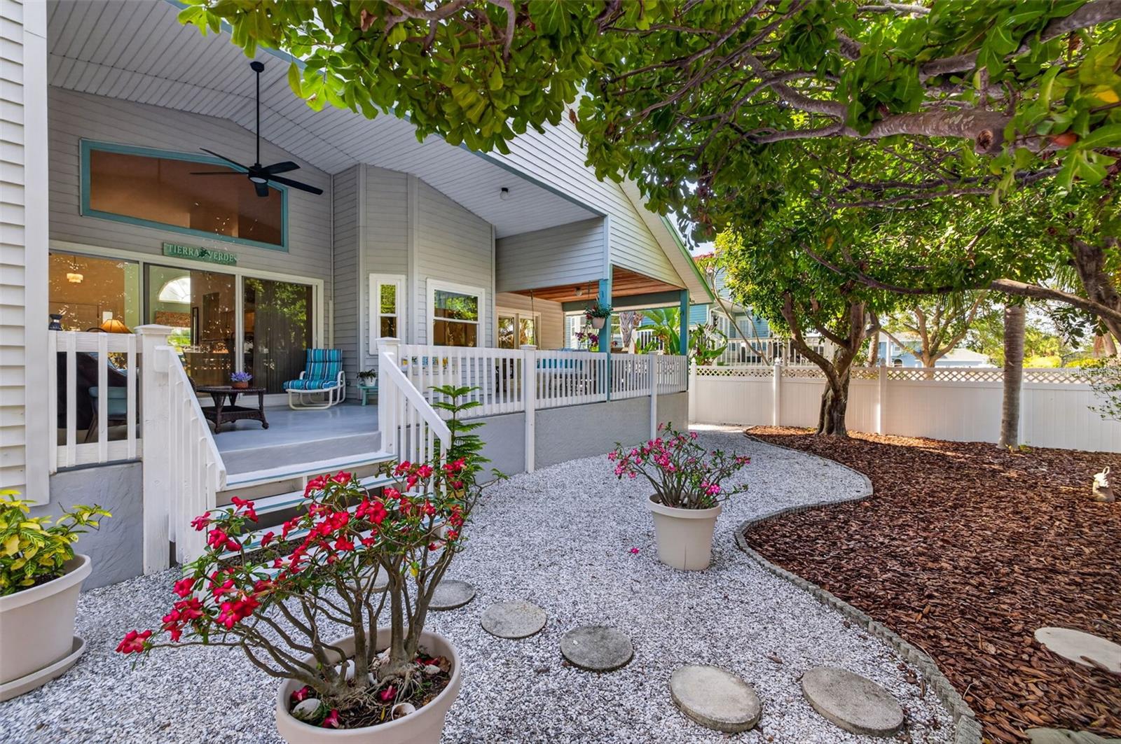 Covered back porch adds outdoor living enjoyment with a shady fenced-in, low-maintenance backyard, perfect for relaxing and entertaining. Roomy enough (and pre-plumbed) for a pool.