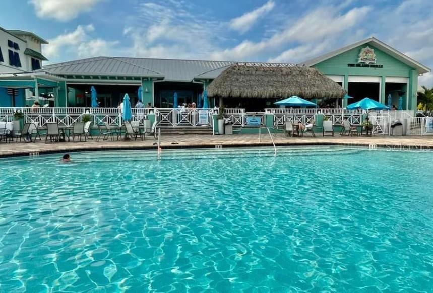 The Island Grille and Raw Bar. This serves as a community pool; for $7 you can purchase a wrist band at the Tiki Bar and enjoy food, drinks, live music and atmosphere until your hearts content!