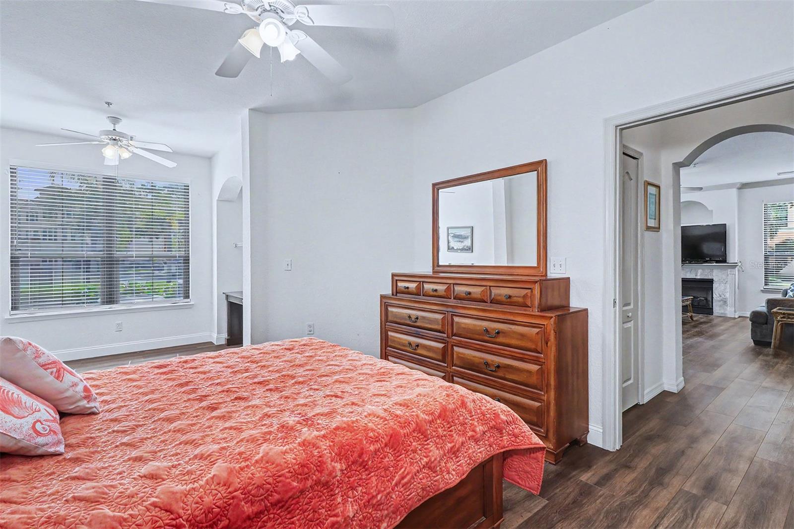 Primary bedroom showing hallway that has a coat closet