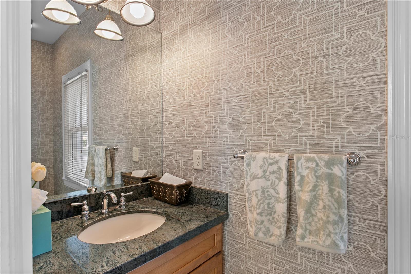 The first floor features two convenient half baths, including one located just off the kitchen.