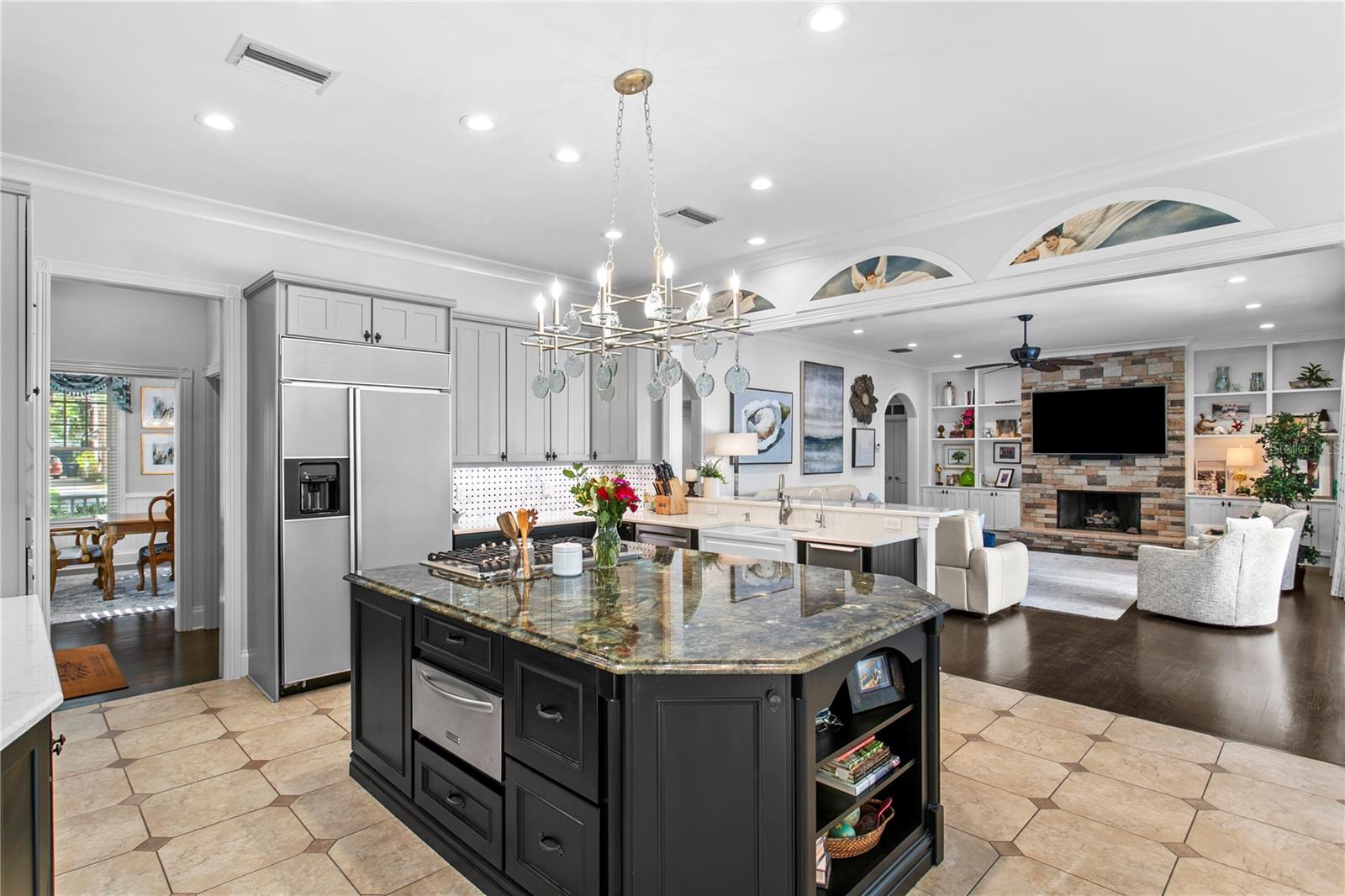 The heart of the home features a spacious kitchen seamlessly connected to the open family room.