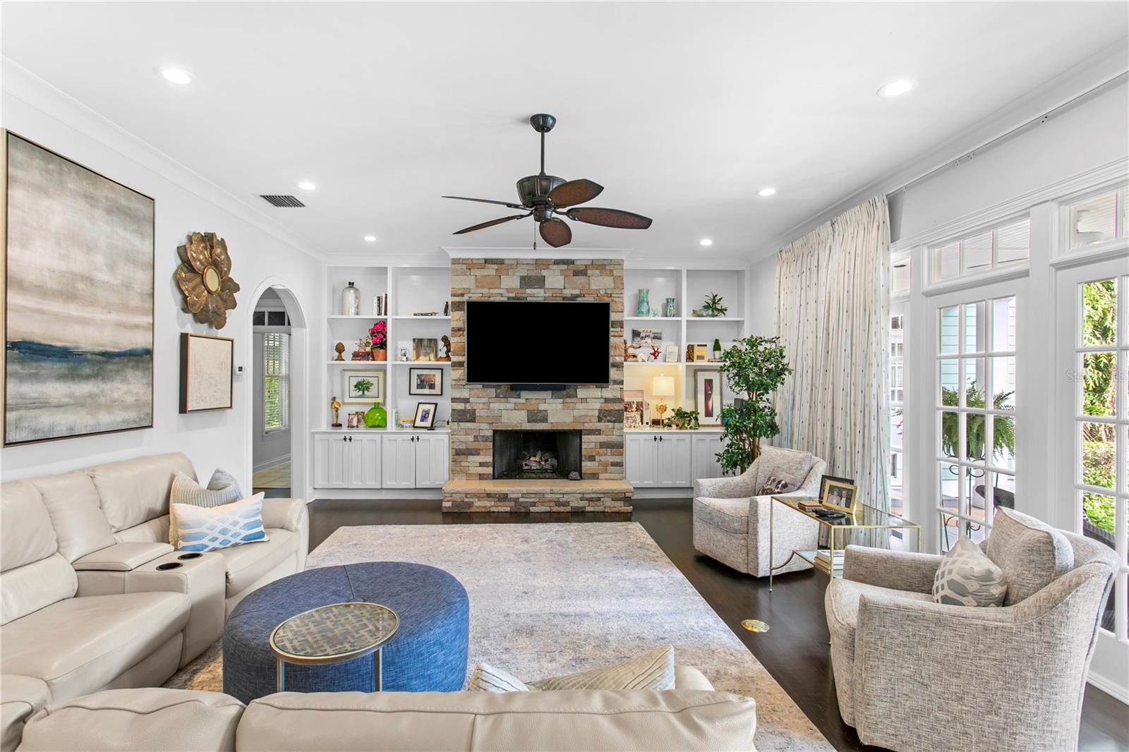 Bright and inviting, the family room features generous seating space, a gas fireplace, and plenty of natural light.