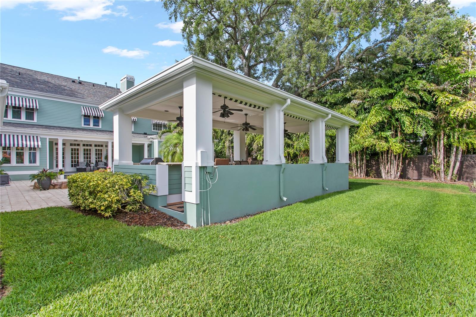 The large lot provides abundant lawn space perfect for pets, playsets, and backyard activities.