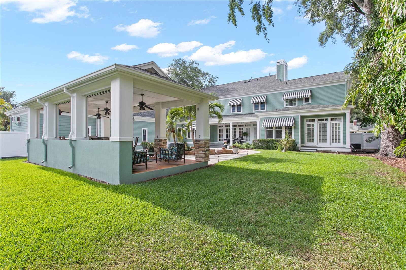 The large lot provides abundant lawn space perfect for pets, playsets, and backyard activities.